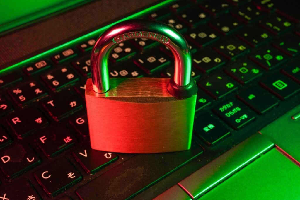 Red padlock on a black computer keyboard representing AI agent security