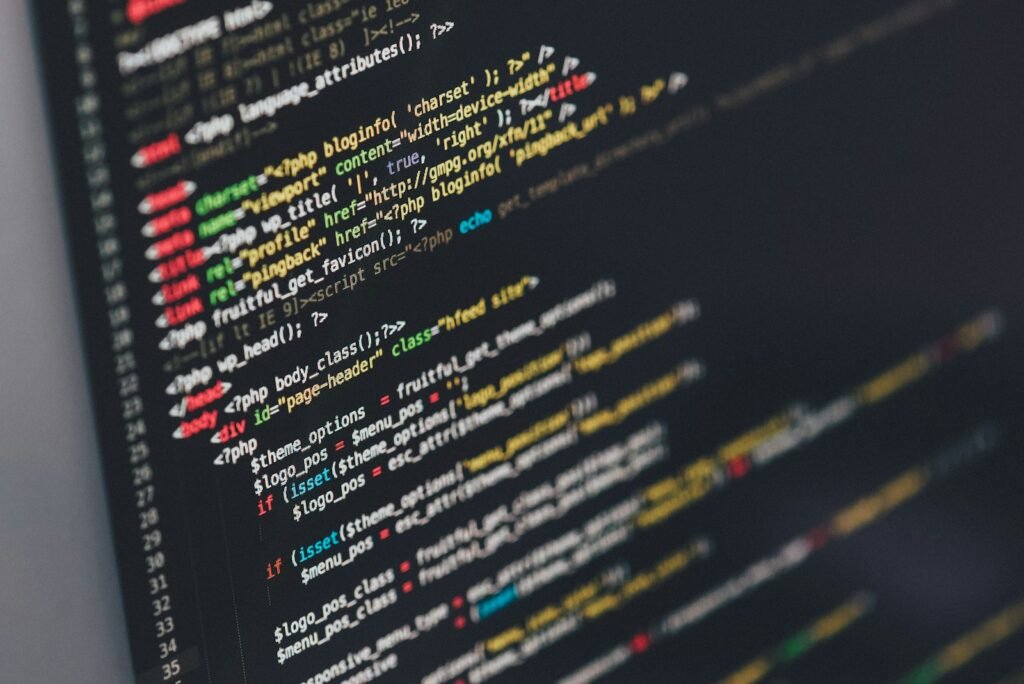 Monitor displaying lines of programming code