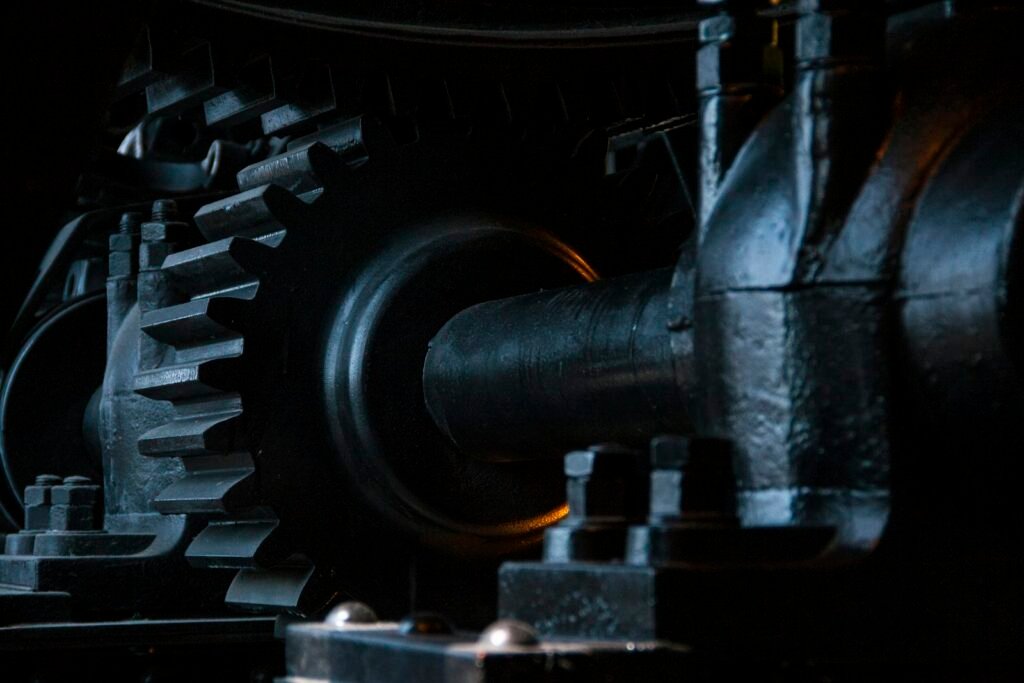 Close-up photograph of black metal gears meshing together
