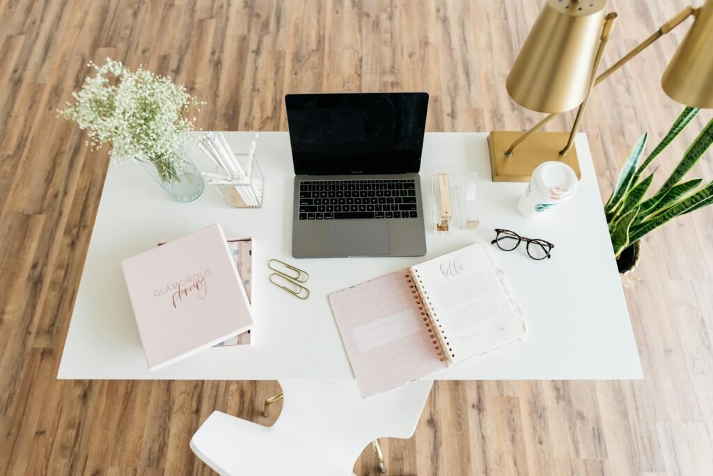 Laptop displaying creative work on a desk