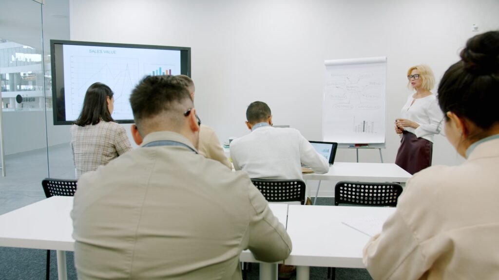 Business people attending a training presentation in a conference room